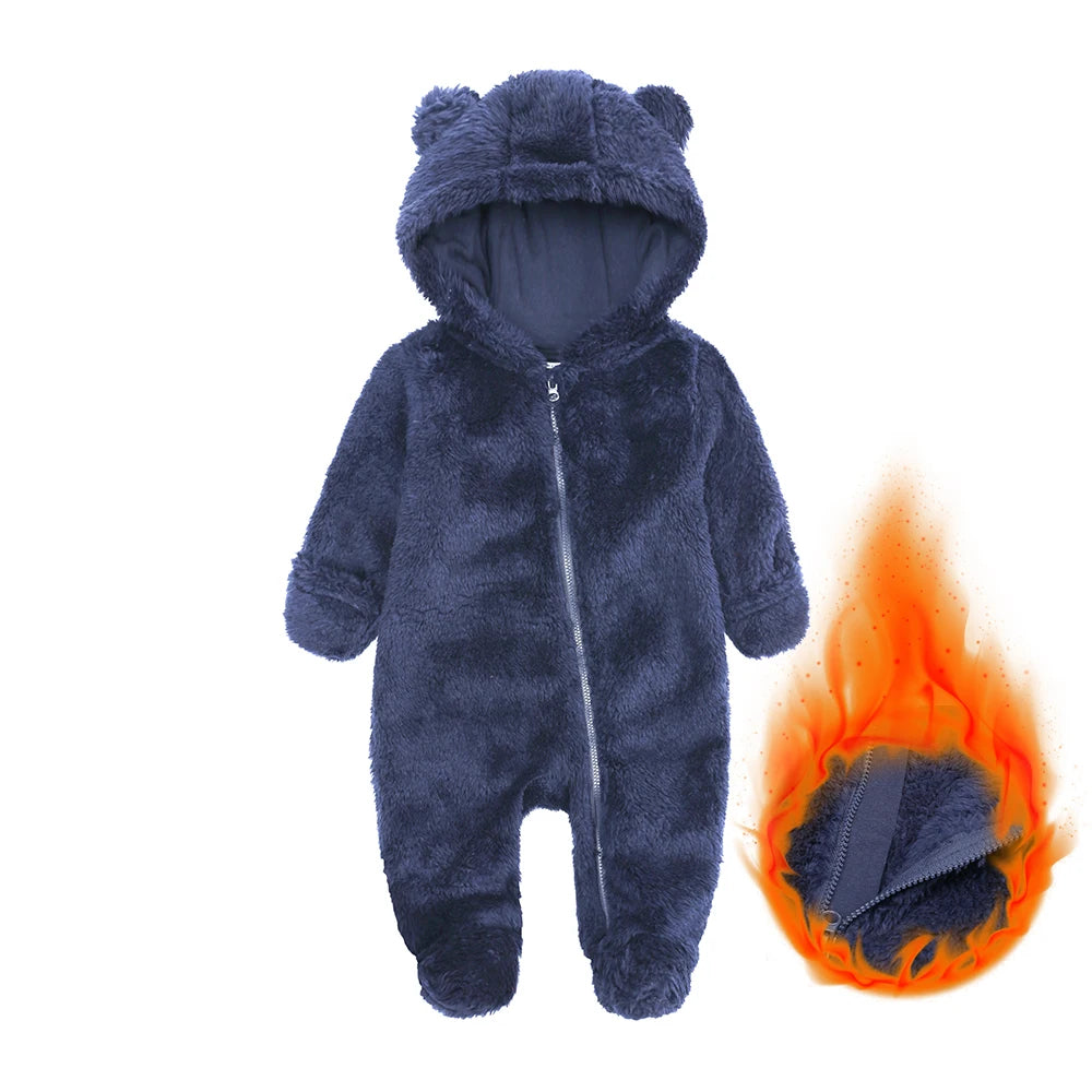 Navy blue baby onesie with bear ears and a flame inset showing fabric texture.