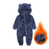 Navy blue baby onesie with bear ears and a flame inset showing fabric texture.