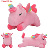 Two pink unicorn plush toys with rainbow horns on a white background.
