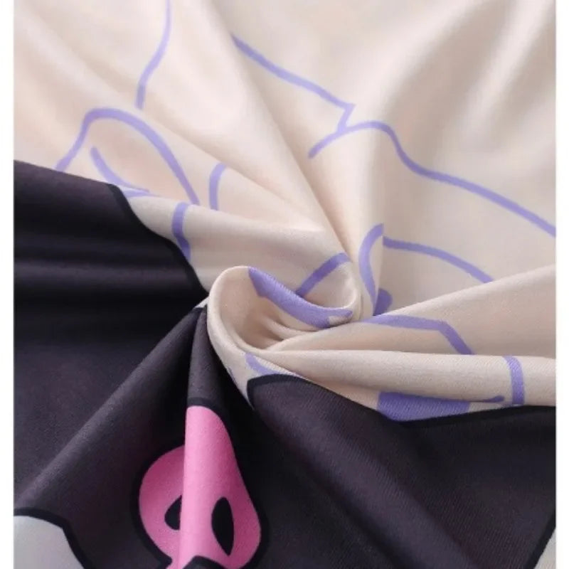 Close-up of fabric with purple geometric pattern on beige background