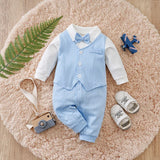 Baby outfit with light blue vest and pants on a fluffy pink surface.