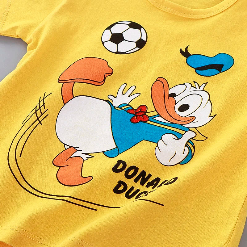 Yellow t-shirt with cartoon character playing soccer on a yellow background