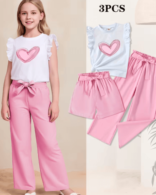Children's outfit with white top and pink pants, featuring a heart design, on a beige background