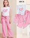 Children's outfit with white top and pink pants, featuring a heart design, on a beige background