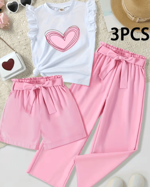 Pink and white outfit with heart design on a textured surface