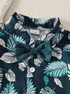 Children's outfit with leaf pattern and bow detail on a neutral background