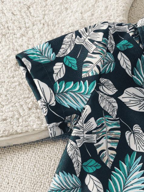 Fabric with tropical leaf pattern on a textured surface