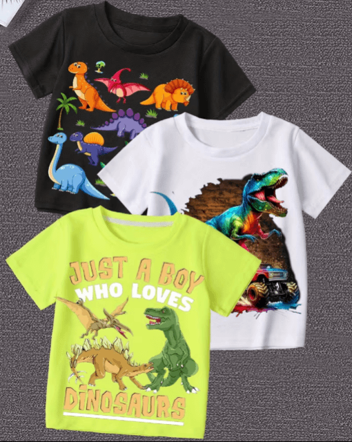 Three children's t-shirts with dinosaur graphics on a gray background