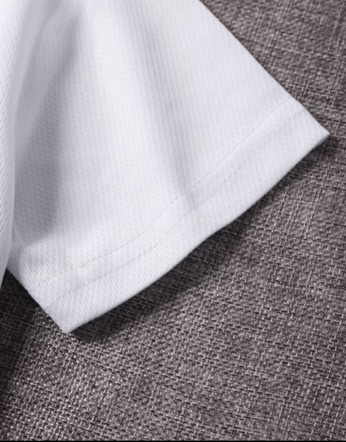 Close-up of white fabric on a textured brown surface