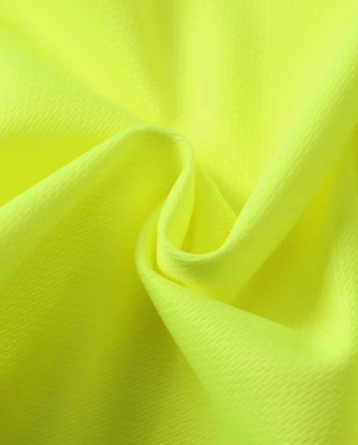Close-up of bright yellow fabric with folds
