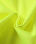 Close-up of bright yellow fabric with folds