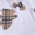 Baby outfit with plaid bear design and bow tie on a white background