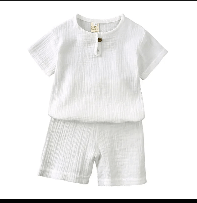 White children's outfit with a shirt and shorts on a white background