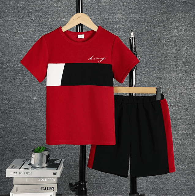 Red, black, and white t-shirt with matching shorts on a gray background