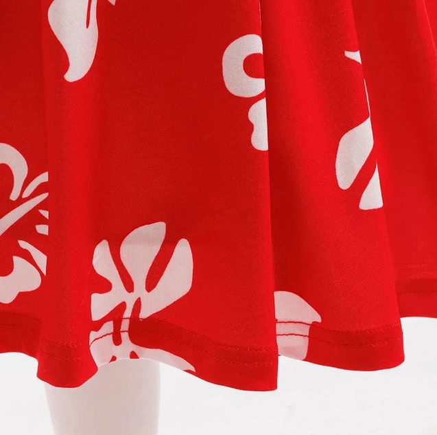 Red fabric with white floral patterns on a white background