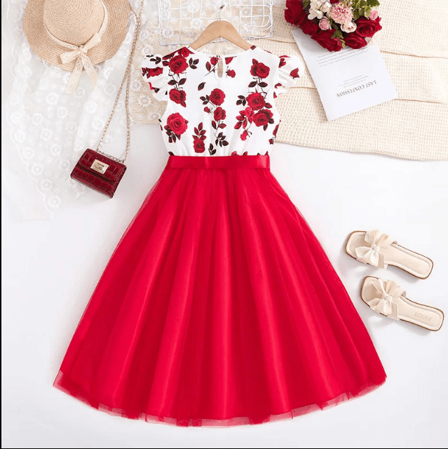 Red and white floral dress with accessories on a white background