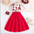 Red and white floral dress with accessories on a white background