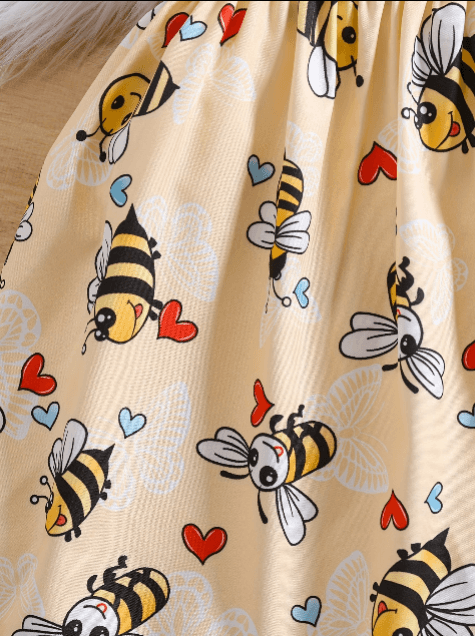 Beige fabric with cartoon bee and heart pattern