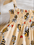 Beige dress with bee and heart pattern on a white background