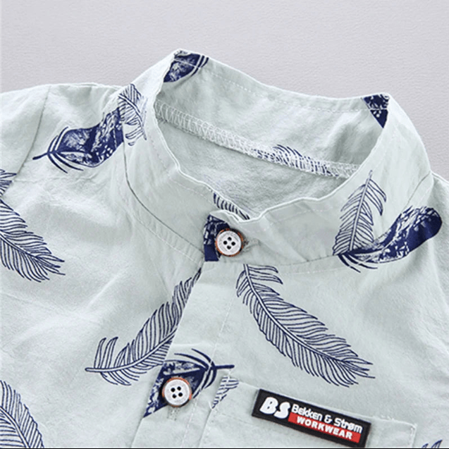 Close-up of a shirt with feather pattern and 'Boden & Strom Workwear' label.