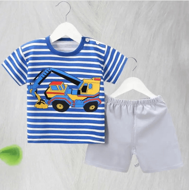 Children's blue and white striped shirt with a toy truck design and gray shorts on hangers against a light gray background.