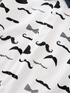White fabric with black bow tie and mustache patterns