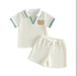 Children's outfit with striped polo shirt and shorts on a white background