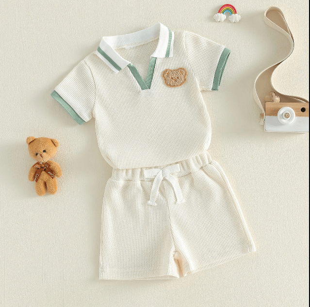 Children's outfit with shorts and shirt on a light background
