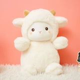 Cute plush toy with animal ears on a soft pink background