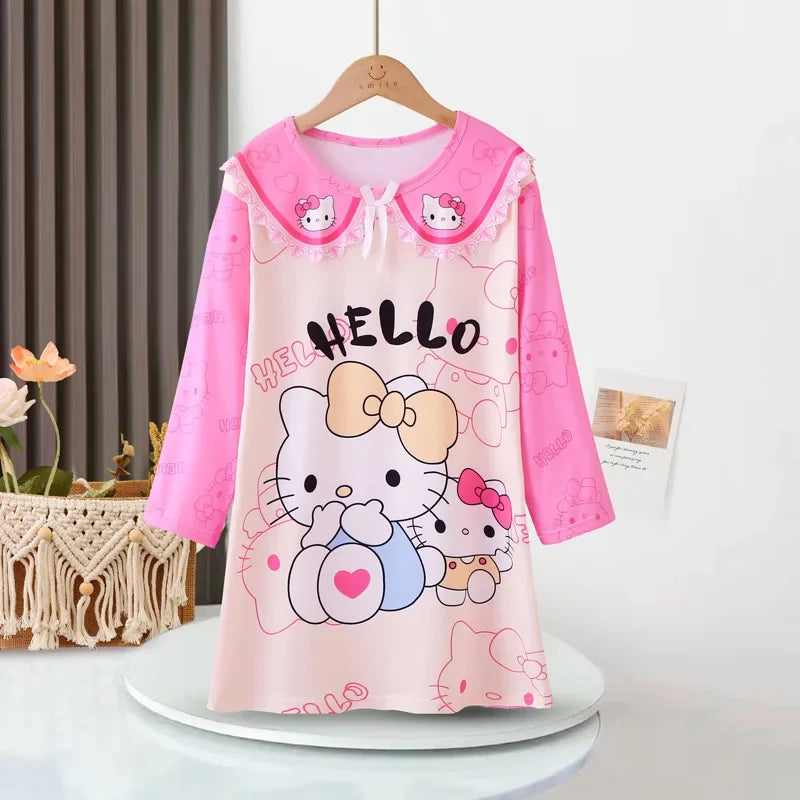 Children's dress with Hello Kitty design on a hanger against a neutral background