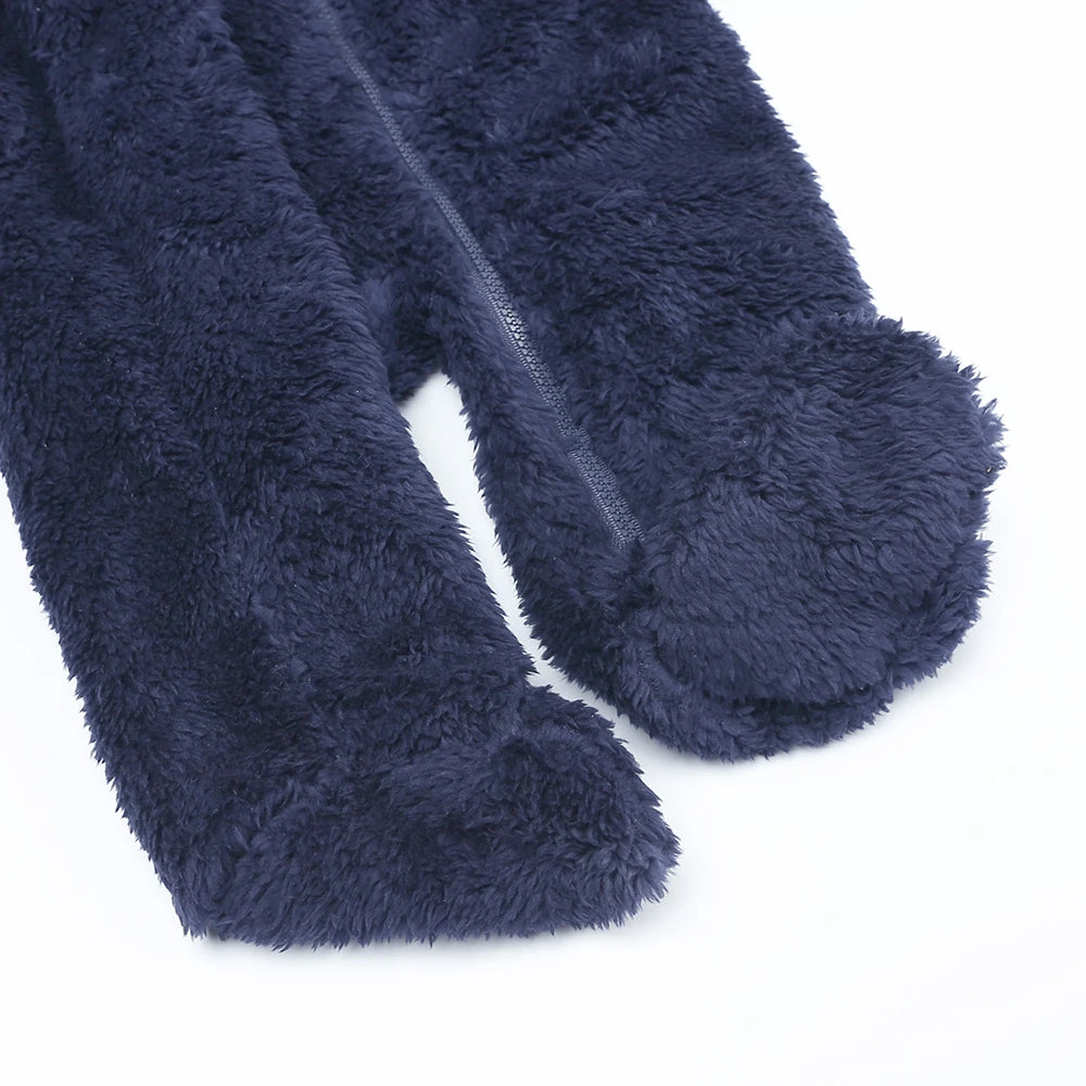 Navy blue fuzzy socks on a white background