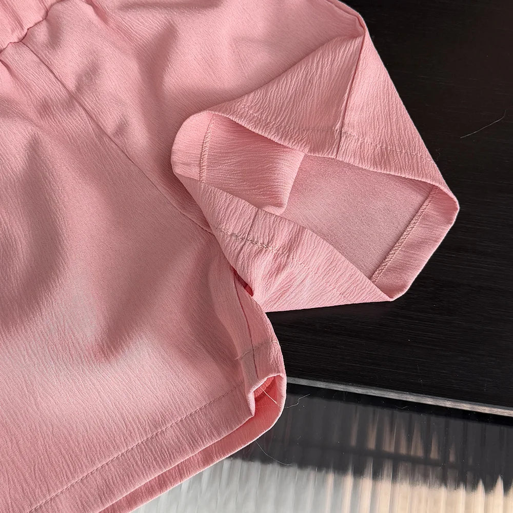 Close-up of a pink fabric with a dark background