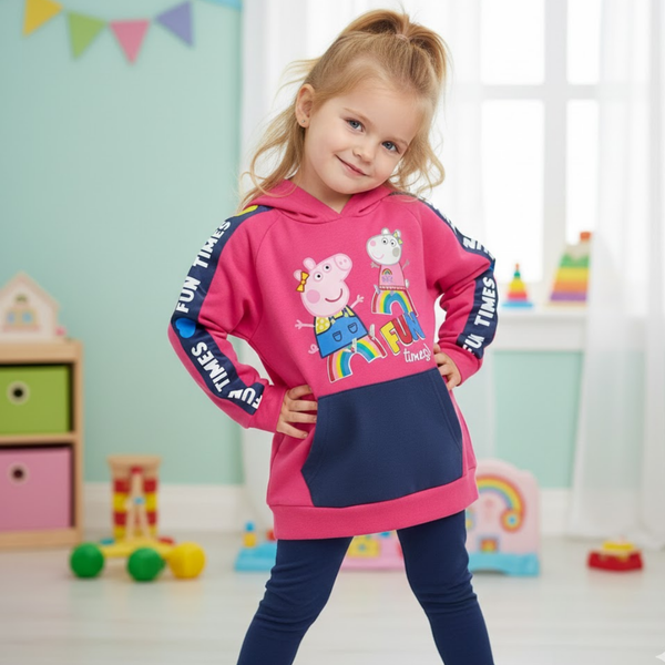 Child wearing a pink hoodie with cartoon character design in a colorful room.