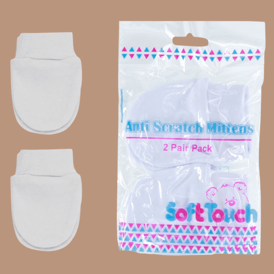 Two white anti-scratch mittens next to their packaging on a brown background
