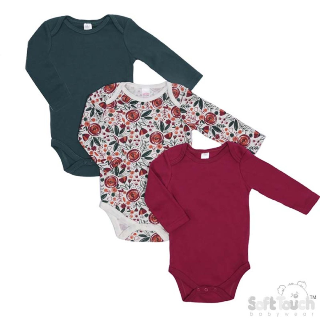 Three long-sleeve baby bodysuits arranged in an overlapping flat lay on a white background: one solid dark teal, one white floral print with red and green roses, and one solid deep burgundy. A Soft Touch Bodywear logo appears in the bottom right corner.