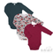 Three long-sleeve baby bodysuits arranged in an overlapping flat lay on a white background: one solid dark teal, one white floral print with red and green roses, and one solid deep burgundy. A Soft Touch Bodywear logo appears in the bottom right corner.