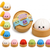 Set of colorful squishy dumplings with a wooden basket on a white background