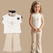 Child wearing a white sleeveless top and beige pants with a matching outfit on a hanger.