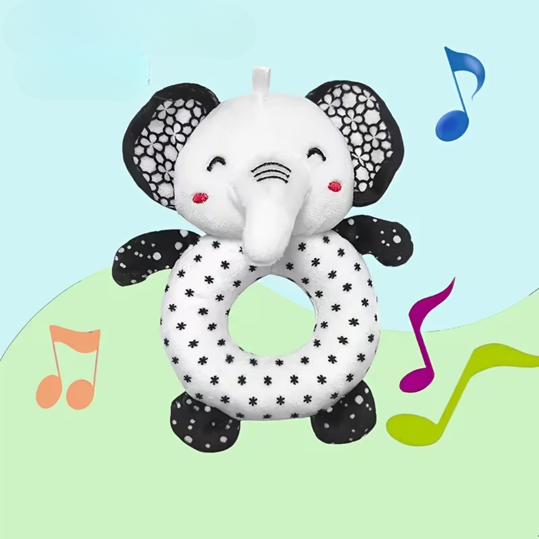 Plush elephant toy with a ring on a colorful background