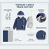 A baby footed sleeper set laid flat on a cream fabric background, including a navy blue and white long-sleeve sleeper with embroidered car details on the chest, and a matching navy blue and white beanie hat.