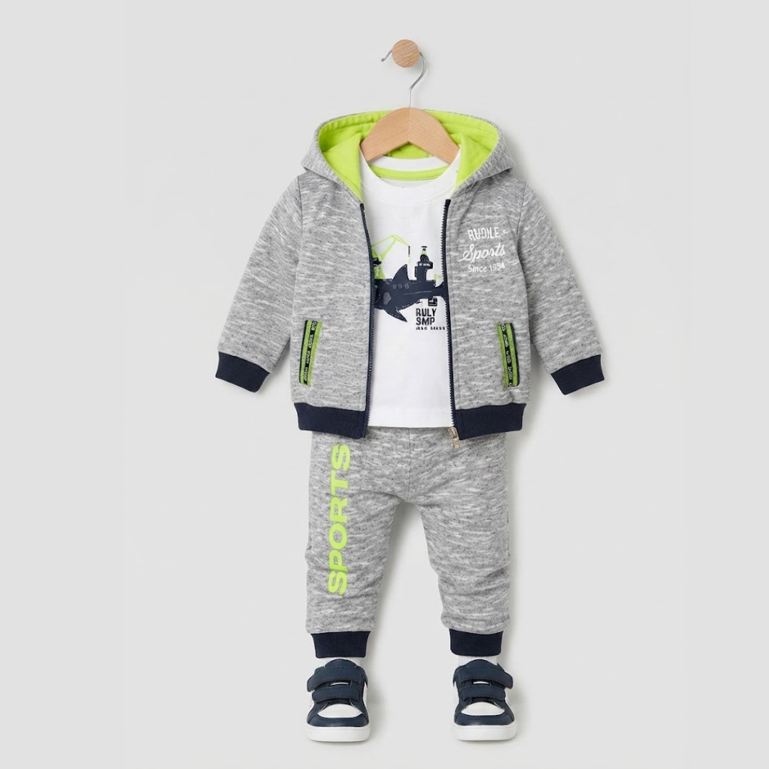 A baby boy's three-piece casual tracksuit set hanging on a wooden hanger against a light gray background. The set includes a heather gray zip-up hoodie with a bright lime green hood lining, navy blue cuffs and hem, and green zipper accents; matching heather gray joggers with navy cuffs and lime green 'SPORTS' text; and a white graphic t-shirt with navy print and 'cool sports' text.