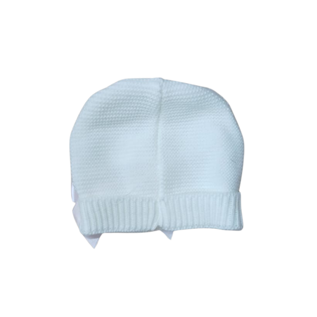 Back view of a white baby knit hat.