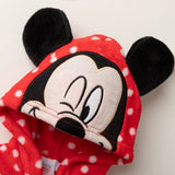 Red polka dot baby romper with cartoon face design on a white background