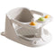 White pet bath seat with colorful buttons on a white background