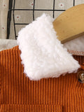 White fluffy object on a textured surface with a wooden tool