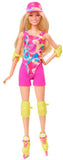 Barbie doll in a colorful outfit with a pink hat and roller skates on a white background