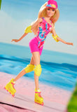 Barbie doll in a swimsuit and roller skates on a beach