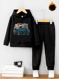 Black hoodie and pants set with monster truck design on a white background