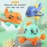 Three colorful toy airplanes with cartoon faces on a light green background.