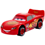 Red toy car with a smiling face on a white background